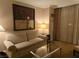 A comfortable sofa and stylish decor create an inviting living room atmosphere with natural light at 135 E Harmon Ave # 2120, Las Vegas, NV 89109
