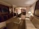 View of the living room featuring a sofa, dining table, and built-in entertainment center at 135 E Harmon Ave # 2120, Las Vegas, NV 89109