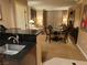View from kitchenette showing a seating arrangement and built-in entertainment unit at 135 E Harmon Ave # 2120, Las Vegas, NV 89109