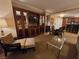 A living room with comfortable seating, elegant built-ins, and a view of the open kitchen and dining area at 135 E Harmon Ave # 2120, Las Vegas, NV 89109