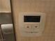 Image shows a white thermostat mounted on the wall, displaying a temperature of 72 degrees Fahrenheit at 135 E Harmon Ave # 2120, Las Vegas, NV 89109