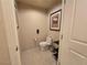 Toilet room featuring a toilet and tiled floors, enhanced by tasteful artwork at 135 E Harmon Ave # 2120, Las Vegas, NV 89109