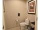 Toilet room featuring a toilet and tiled floors, enhanced by tasteful artwork at 135 E Harmon Ave # 2120, Las Vegas, NV 89109