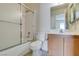 Bathroom with vanity, toilet, shower, and tub at 1412 Oak Rock Dr # 202, Las Vegas, NV 89128