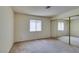 Bedroom with carpet, window, and mirrored closet doors at 1412 Oak Rock Dr # 202, Las Vegas, NV 89128
