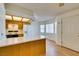 Bright kitchen featuring wood cabinets and laminate countertops at 1412 Oak Rock Dr # 202, Las Vegas, NV 89128