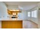 Bright kitchen featuring wood cabinets and laminate countertops at 1412 Oak Rock Dr # 202, Las Vegas, NV 89128