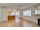 Open living area with decorative stone fireplace, modern flooring, and views of the kitchen at 1412 Oak Rock Dr # 202, Las Vegas, NV 89128