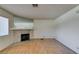 This living room showcases wood floors, natural light and a stone fireplace at 1412 Oak Rock Dr # 202, Las Vegas, NV 89128