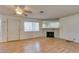 This living room showcases wood floors, natural light and a stone fireplace at 1412 Oak Rock Dr # 202, Las Vegas, NV 89128