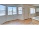 Bright, open living room with wood floors, multiple windows, and a convenient front door at 1412 Oak Rock Dr # 202, Las Vegas, NV 89128