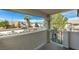 Covered patio view looking out at desert landscaping, mountains, and a sunny street at 1412 Oak Rock Dr # 202, Las Vegas, NV 89128