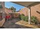 The backyard features a covered patio and a well-maintained garden with mature plantings at 1453 Blisworth Ct # 102, Las Vegas, NV 89102