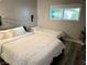 Cozy bedroom with two beds and a window offering natural light at 2250 Red Rock St, Las Vegas, NV 89146
