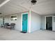 Exterior view of a gray home featuring a blue door and outdoor seating at 2250 Red Rock St, Las Vegas, NV 89146