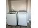 Bright laundry area features a washing machine and a dryer set at 2250 Red Rock St, Las Vegas, NV 89146