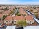 Community aerial featuring multiple buildings, community car park, and lush landscaping at 2300 E Silverado Ranch Blvd # 1059, Las Vegas, NV 89183