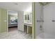 Bright bathroom featuring a shower over tub, double sink vanity, and marble tile floors at 2300 E Silverado Ranch Blvd # 1059, Las Vegas, NV 89183
