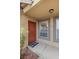 Eye-level view of the front entrance featuring a solid door, decorative welcome mat and address numbers at 2300 E Silverado Ranch Blvd # 1059, Las Vegas, NV 89183
