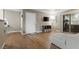 The view of the living room showcasing the floors, front door, sliding door, furniture and decor at 2300 E Silverado Ranch Blvd # 1059, Las Vegas, NV 89183