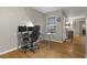 View of the home office with hardwood floors, neutral paint, and a ceiling fan with lights at 2300 E Silverado Ranch Blvd # 1059, Las Vegas, NV 89183