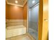 Bright bathroom featuring a soaking tub, tiled shower with glass door, and neutral color palette at 2405 Serene Ave # 241, Las Vegas, NV 89123