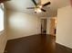 Bedroom features ceiling fan, dark wood floors, and en suite bathroom and closet at 2405 Serene Ave # 241, Las Vegas, NV 89123