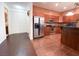 Kitchen features stainless steel appliances, breakfast bar and tile floors at 2405 Serene Ave # 241, Las Vegas, NV 89123