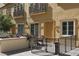 View of private patio area with wrought iron fence and a small outdoor seating area at 2405 Serene Ave # 241, Las Vegas, NV 89123