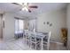 Cozy dining area with tile flooring, a modern table, and soft natural lighting at 320 Ellen Marie Dr, Las Vegas, NV 89110