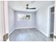 Neutral bedroom with a ceiling fan and a bright window at 3905 Casa Grande Ave, Las Vegas, NV 89102