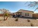 Nice backyard featuring covered patio, desert landscaping, and block wall fencing at 3924 E Garfield Dr, Pahrump, NV 89061