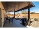 Relaxing covered patio with outdoor seating and well-kept gravel landscaping at 3924 E Garfield Dr, Pahrump, NV 89061