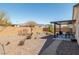 The backyard features a covered patio, desert landscaping, and complete privacy at 3924 E Garfield Dr, Pahrump, NV 89061