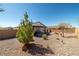 The spacious backyard has a covered patio, desert landscaping, and mountain views at 3924 E Garfield Dr, Pahrump, NV 89061