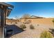 Relaxing backyard featuring covered patio, desert landscaping, and complete privacy at 3924 E Garfield Dr, Pahrump, NV 89061