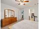 Comfortable bedroom featuring ceiling fan, dresser and closet at 3924 E Garfield Dr, Pahrump, NV 89061