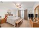 Serene bedroom with a ceiling fan, neutral decor, and plenty of natural light at 3924 E Garfield Dr, Pahrump, NV 89061
