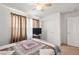 Bright bedroom featuring carpeted floors, a ceiling fan, and sliding closet doors for ample storage at 3924 E Garfield Dr, Pahrump, NV 89061