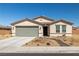 Charming single-story home with a low-maintenance desert landscape and attached two-car garage at 3924 E Garfield Dr, Pahrump, NV 89061