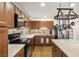 Well-appointed kitchen with stainless appliances, ample cabinetry, and stone backsplash at 3924 E Garfield Dr, Pahrump, NV 89061