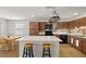 This kitchen island features stainless steel appliances, modern cabinets, and barstool seating at 3924 E Garfield Dr, Pahrump, NV 89061
