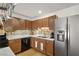 Nicely-designed kitchen boasts stainless steel appliances, wooden cabinetry, and ample countertop space at 3924 E Garfield Dr, Pahrump, NV 89061