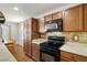 Lovely kitchen showcases stainless steel appliances, wooden cabinets, and a bright breakfast nook at 3924 E Garfield Dr, Pahrump, NV 89061