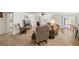 A spacious living room is brightened by natural light through a glass sliding door and large windows at 3924 E Garfield Dr, Pahrump, NV 89061