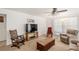 The bright living room is centered around a flat screen TV and comfortable seating for Gathering and guests at 3924 E Garfield Dr, Pahrump, NV 89061