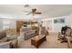 This spacious living room flows seamlessly into a bright dining and kitchen area at 3924 E Garfield Dr, Pahrump, NV 89061