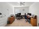 Versatile home office featuring carpeted floors, multiple desks, and ample shelving for storage and organization at 3924 E Garfield Dr, Pahrump, NV 89061