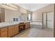 Spacious bathroom features double sinks, a soaking tub, and a separate glass-enclosed shower at 399 Placer Creek Ln, Henderson, NV 89014