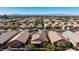 An aerial view highlighting the tile roof, desert landscaping, and neighborhood at 4012 Shetland Pony St, Las Vegas, NV 89122